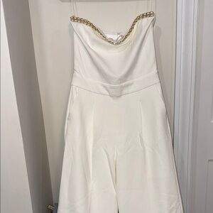 Elegant White Bootcut Strapless Jumpsuit with Gold Chain Detail